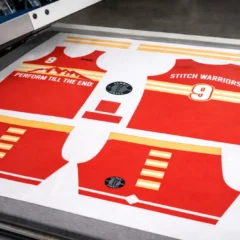 After sourcing, the fabric is cut into panels based on the patterns. Then, depending on the client's requirements, these panels undergo printing or embroidery.